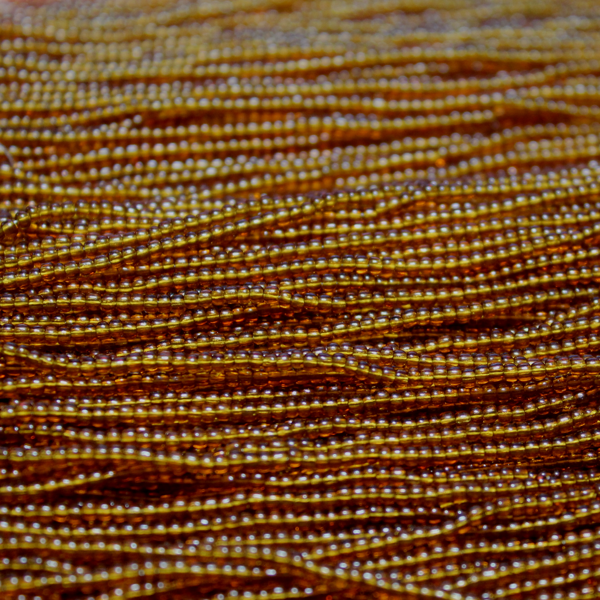 11/0 Czech Transparent Dark Topaz - 1193