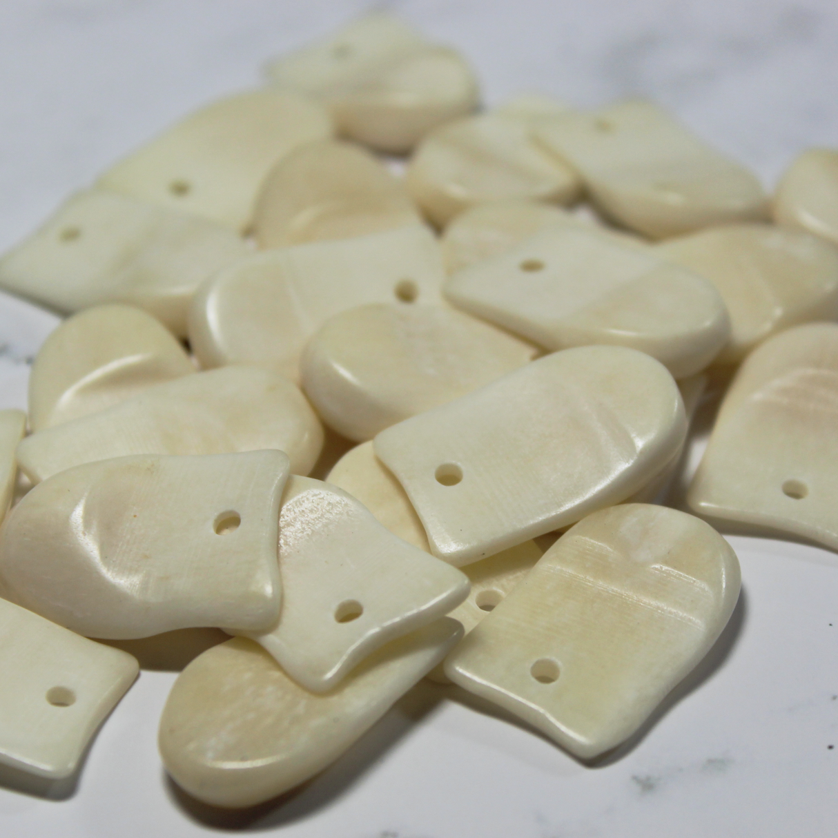 1" Imitation (Bone) Elk Teeth, 24 pieces.