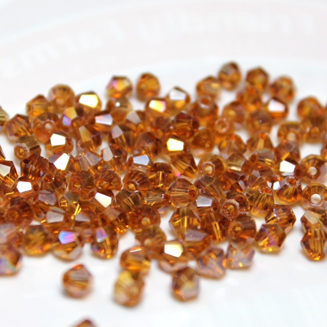 3mm Transparent Topaz AB Glass Bicone - 3B11